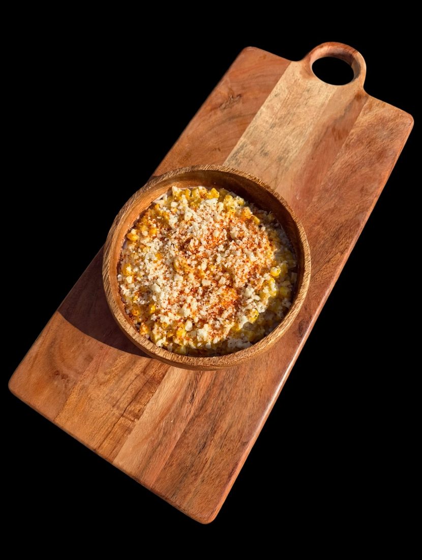 Classic elote in a cup with cotija and chile