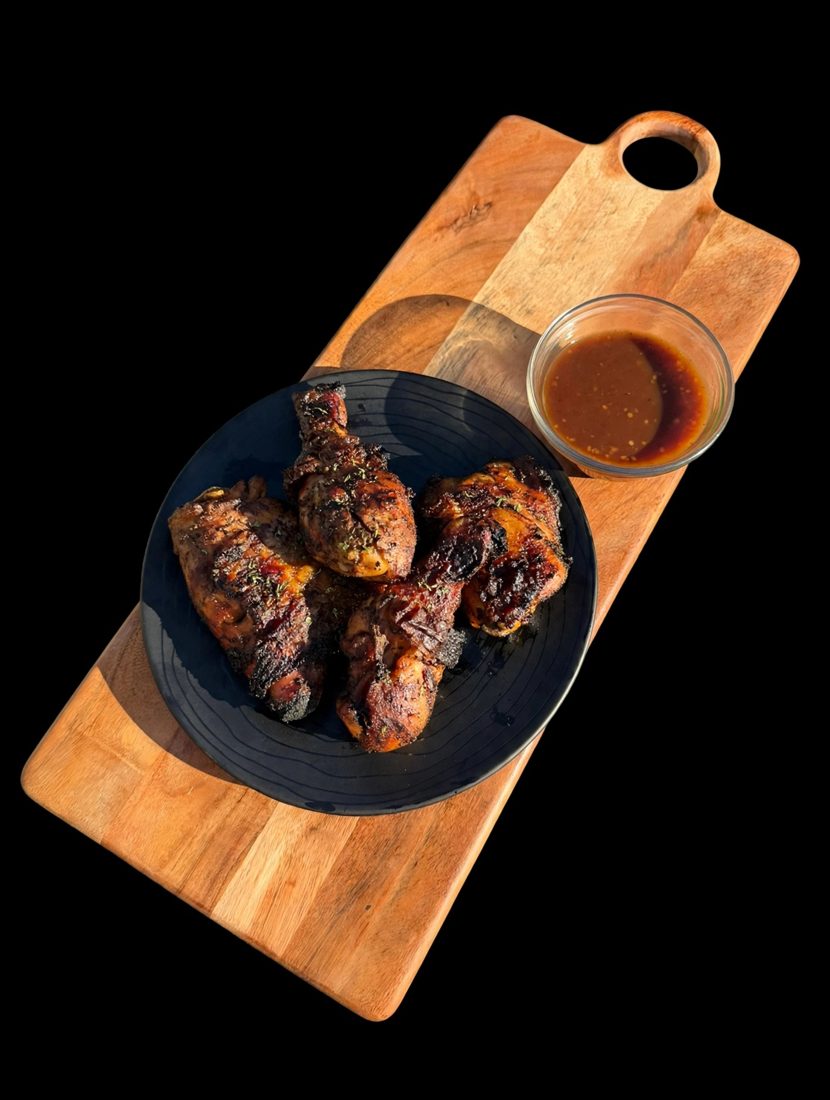 Grilled jerk chicken with dipping sauce